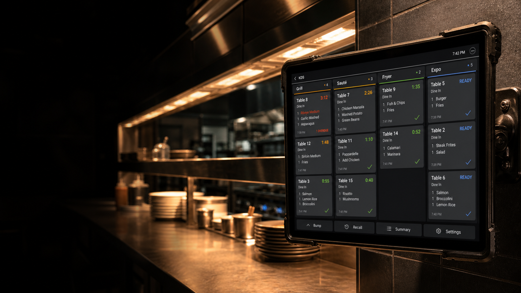 Kitchen display system screen showing routed restaurant tickets and prep status